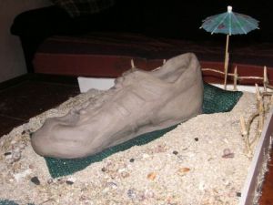 Sculpture de as: chaussure au repos